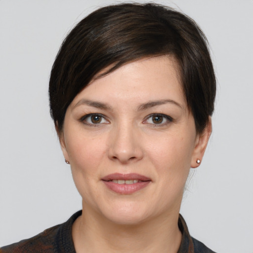 Joyful white young-adult female with medium  brown hair and brown eyes