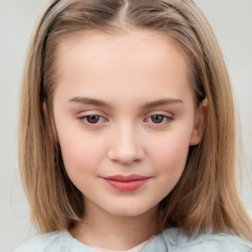 Joyful white child female with medium  brown hair and brown eyes