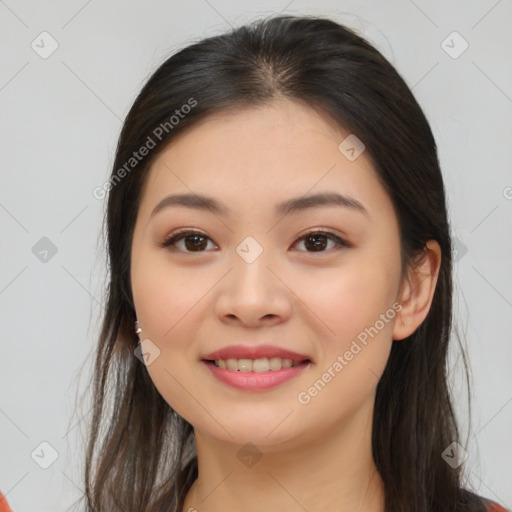 Joyful asian young-adult female with long  brown hair and brown eyes