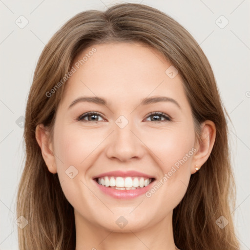 Joyful white young-adult female with long  brown hair and grey eyes