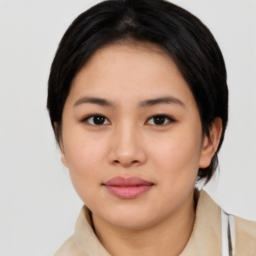 Joyful asian young-adult female with medium  black hair and brown eyes