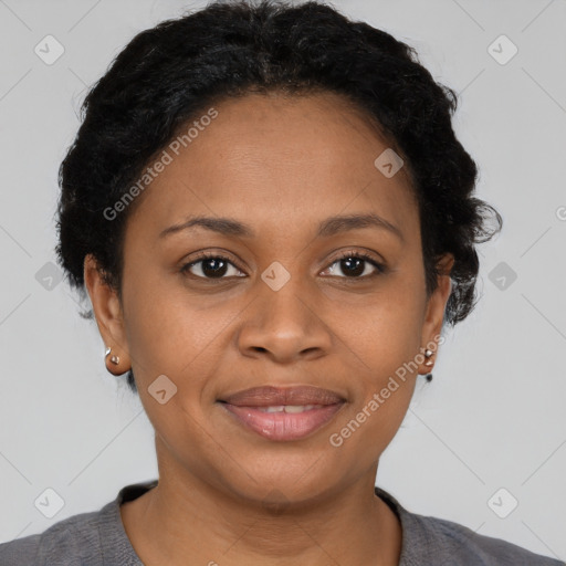 Joyful black adult female with short  brown hair and brown eyes