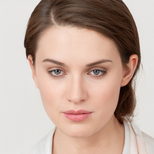 Neutral white young-adult female with medium  brown hair and grey eyes