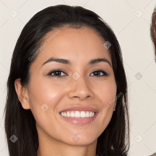 Joyful latino young-adult female with long  brown hair and brown eyes