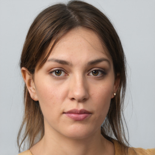 Neutral white young-adult female with medium  brown hair and brown eyes