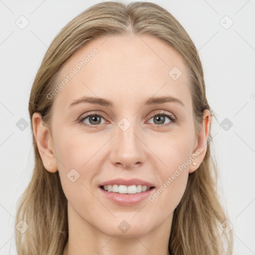 Joyful white young-adult female with long  brown hair and blue eyes