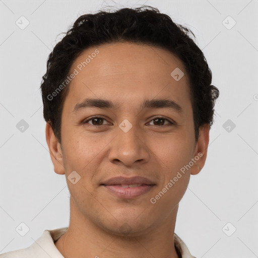 Joyful latino young-adult male with short  brown hair and brown eyes