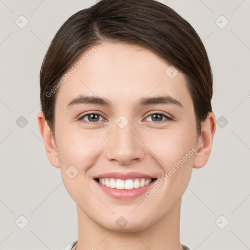 Joyful white young-adult female with short  brown hair and brown eyes