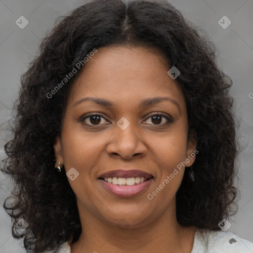 Joyful black young-adult female with medium  brown hair and brown eyes