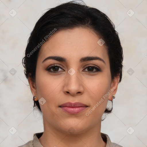 Joyful latino young-adult female with medium  brown hair and brown eyes