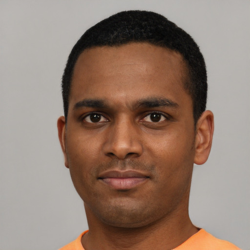 Neutral black young-adult male with short  black hair and brown eyes