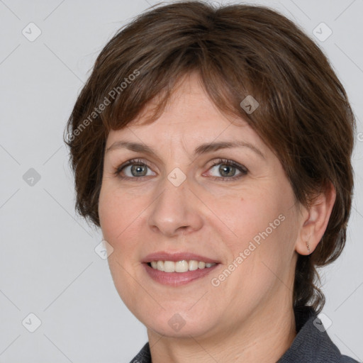 Joyful white adult female with medium  brown hair and grey eyes