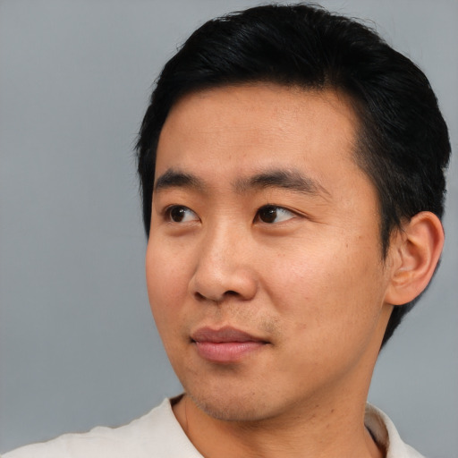 Neutral asian young-adult male with short  black hair and brown eyes