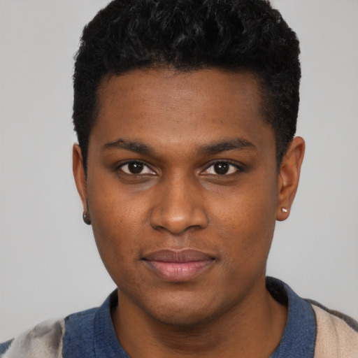 Joyful black young-adult male with short  black hair and brown eyes