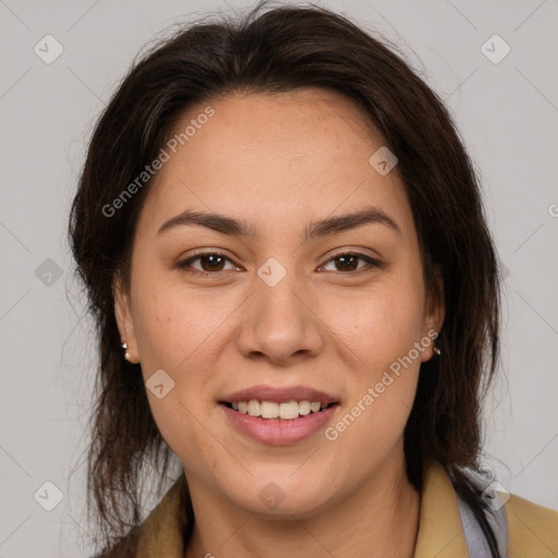 Joyful latino young-adult female with medium  brown hair and brown eyes