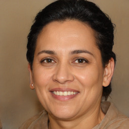 Joyful white adult female with medium  brown hair and brown eyes