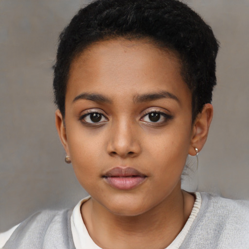 Neutral black child female with short  black hair and brown eyes