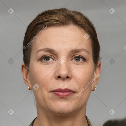 Joyful white adult female with short  brown hair and grey eyes