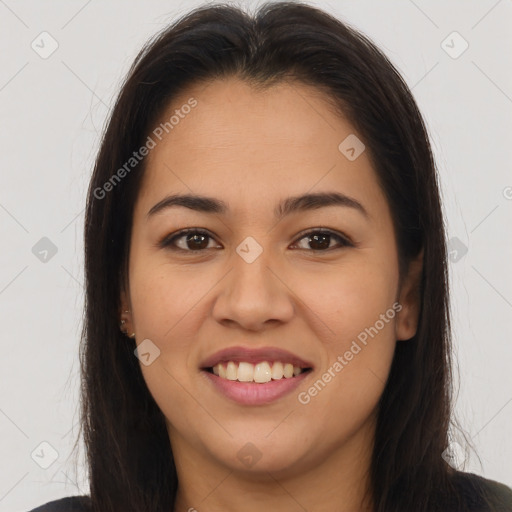 Joyful latino young-adult female with long  brown hair and brown eyes