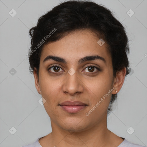 Joyful latino young-adult female with short  brown hair and brown eyes