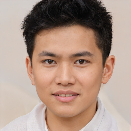 Joyful asian young-adult male with short  brown hair and brown eyes