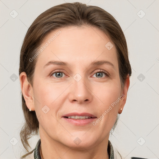 Joyful white adult female with short  brown hair and grey eyes