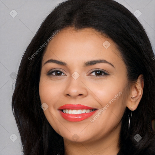 Joyful latino young-adult female with long  black hair and brown eyes