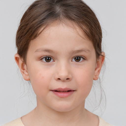 Joyful white child female with medium  brown hair and brown eyes