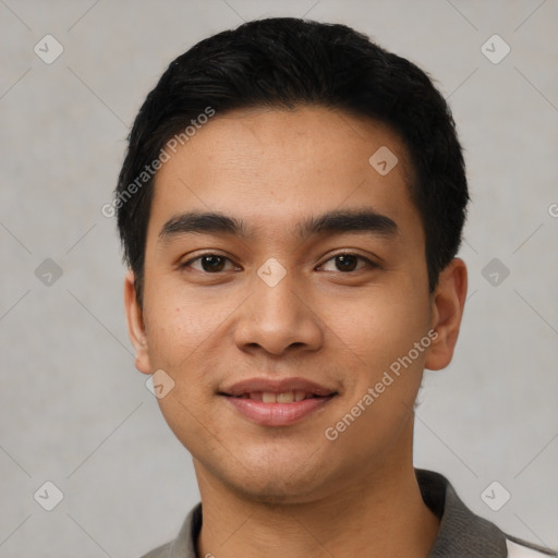 Joyful latino young-adult male with short  black hair and brown eyes