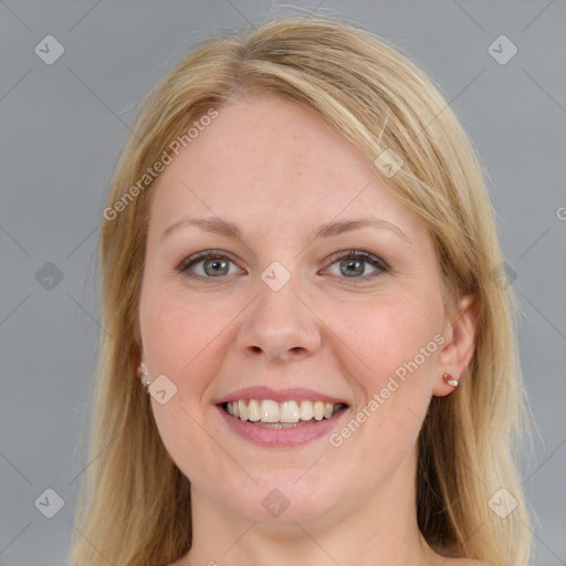 Joyful white adult female with medium  brown hair and blue eyes