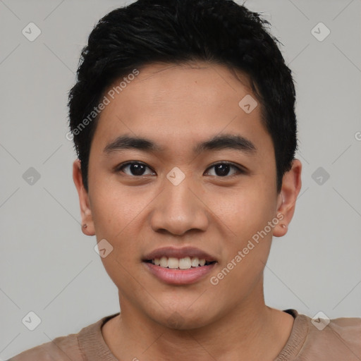 Joyful asian young-adult male with short  black hair and brown eyes