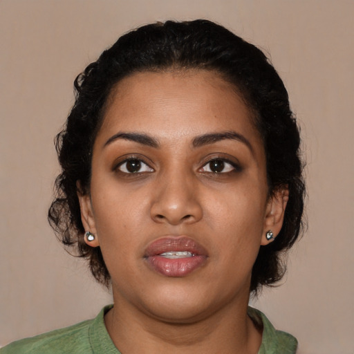 Neutral black young-adult female with medium  brown hair and brown eyes