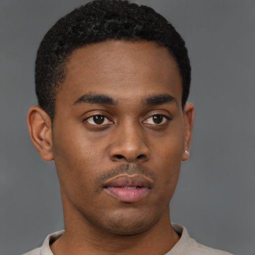 Neutral black young-adult male with short  brown hair and brown eyes