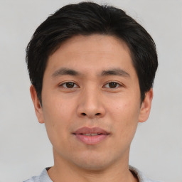 Neutral asian young-adult male with short  brown hair and brown eyes