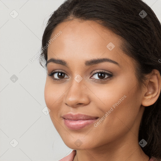 Joyful latino young-adult female with long  brown hair and brown eyes