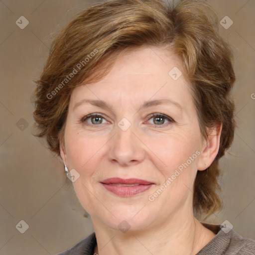 Joyful white adult female with medium  brown hair and grey eyes