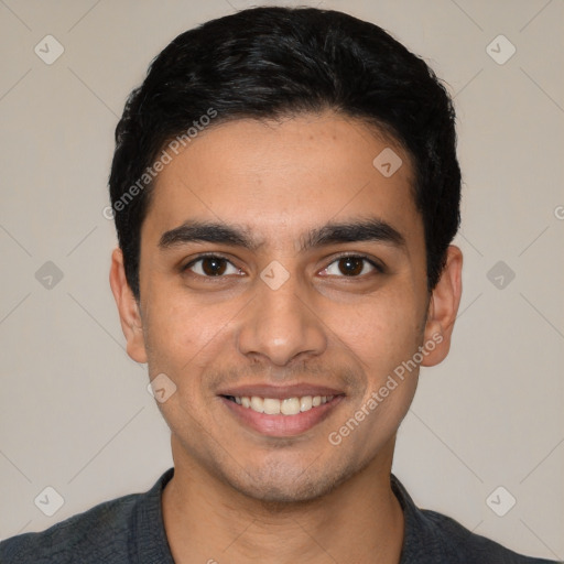 Joyful white young-adult male with short  black hair and brown eyes