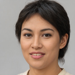 Joyful asian young-adult female with medium  brown hair and brown eyes