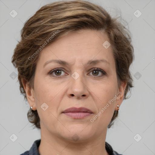 Joyful white adult female with medium  brown hair and grey eyes