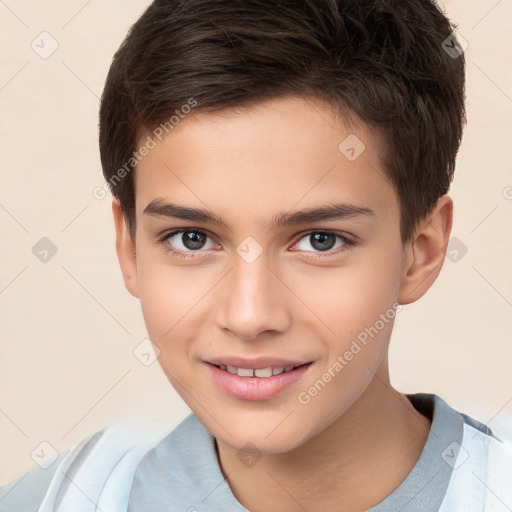 Joyful white child male with short  brown hair and brown eyes