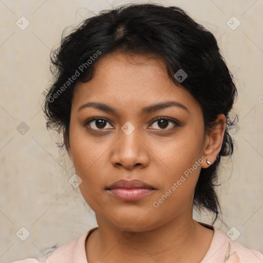 Joyful latino young-adult female with medium  brown hair and brown eyes