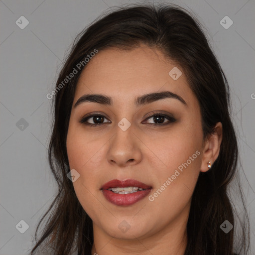 Joyful white young-adult female with long  brown hair and brown eyes