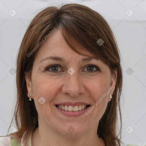 Joyful white adult female with medium  brown hair and brown eyes