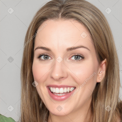 Joyful white young-adult female with long  brown hair and green eyes