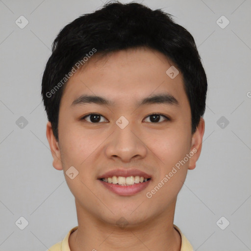 Joyful asian young-adult male with short  black hair and brown eyes