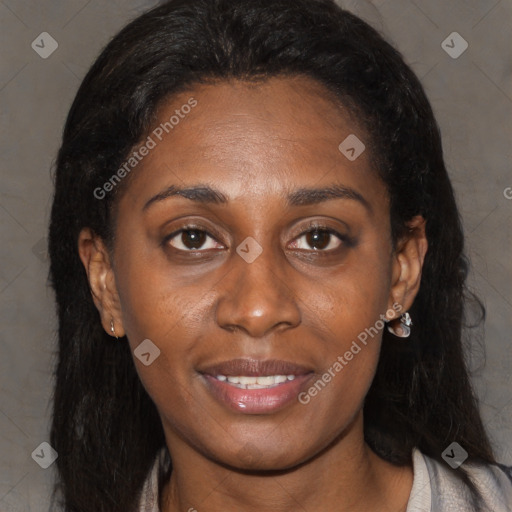 Joyful black young-adult female with long  brown hair and brown eyes