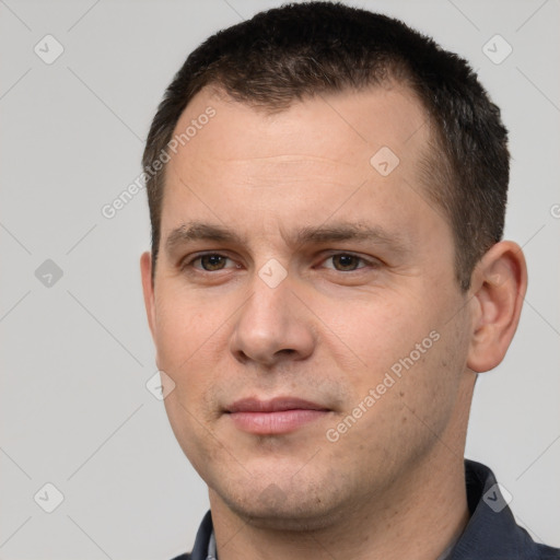 Joyful white young-adult male with short  brown hair and brown eyes