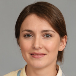 Joyful white young-adult female with medium  brown hair and brown eyes