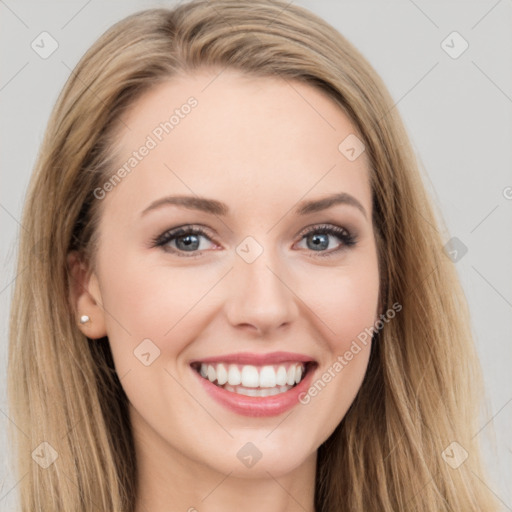 Joyful white young-adult female with long  brown hair and blue eyes