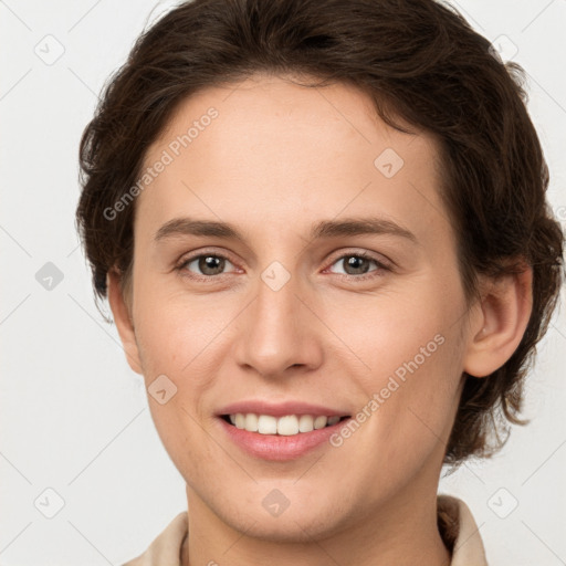 Joyful white young-adult female with short  brown hair and grey eyes